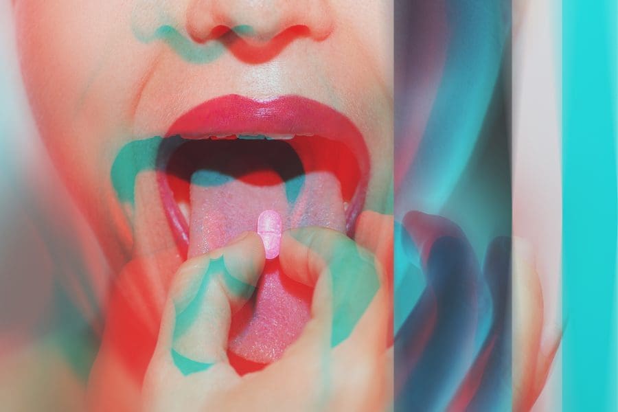 A woman experiencing a psychedelic experience on ecstasy, begging the question, "Is MDMA addictive?"